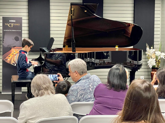 student playing on CF series yamaha piano for recital