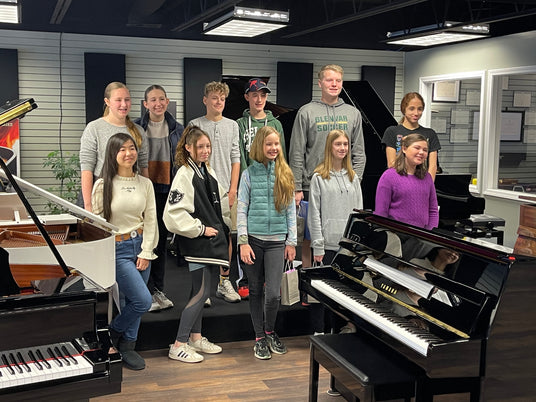 piano students inside studio at apex piano showroom