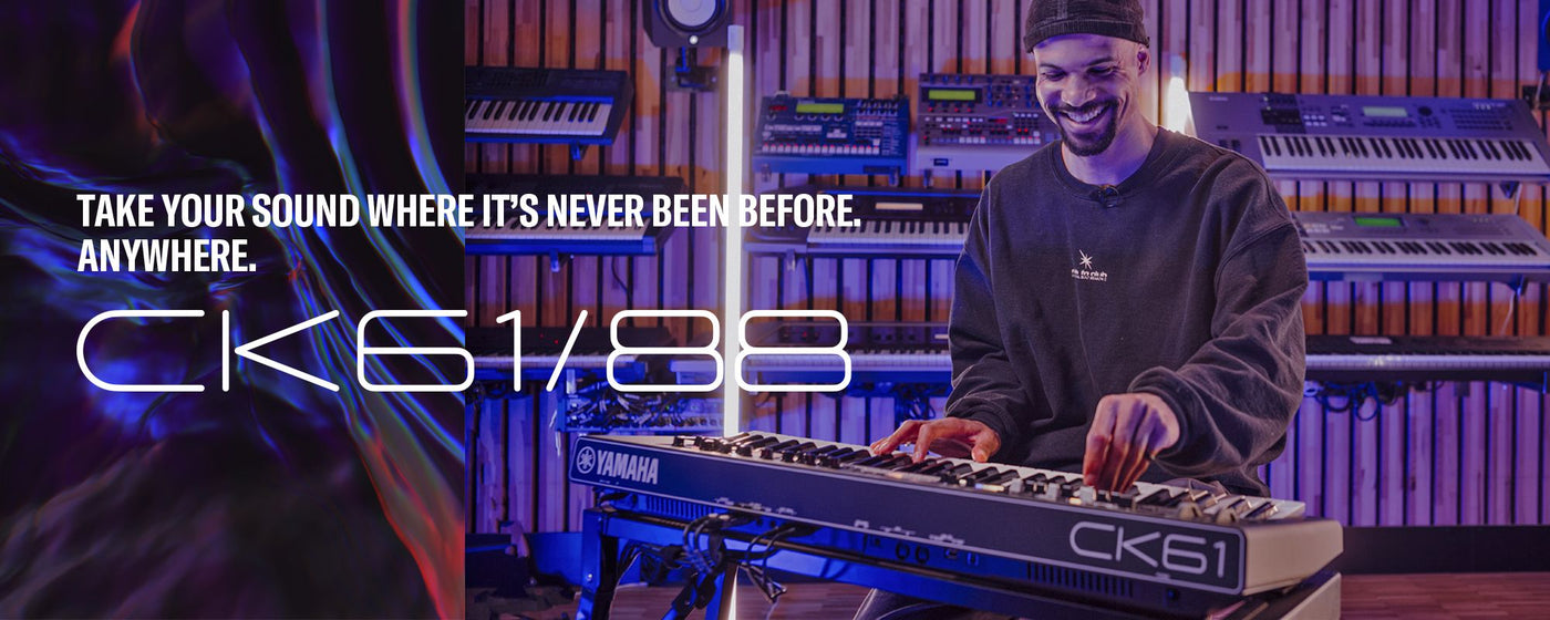 a man with a beaming smile playing a yamaha keyboard in a studio filled with various musical equipment, with the slogan "take your sound where it's never been before. anywhere." and the text "ck61/88" overlaid on the image.