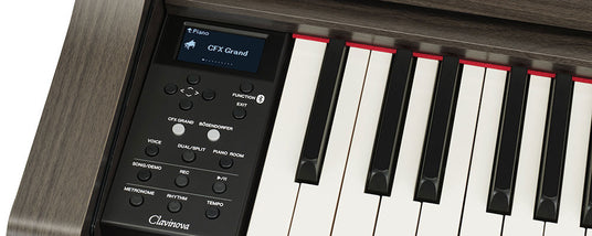 Close-up view of a digital piano's keyboard and control panel, displaying options such as "CFX Grand" and "Bösendorfer" on its screen, with the brand "Clavinova" visible.