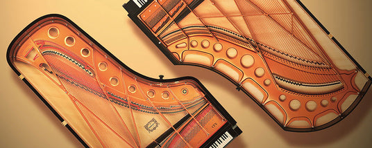 Two transparent grand pianos revealing the intricate internal mechanisms and strings, set against a neutral background.
