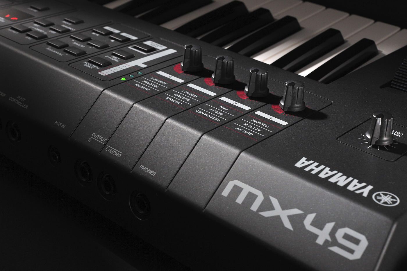 close-up photo of a yamaha mx49 music synthesizer keyboard, showcasing the control panel and keys.